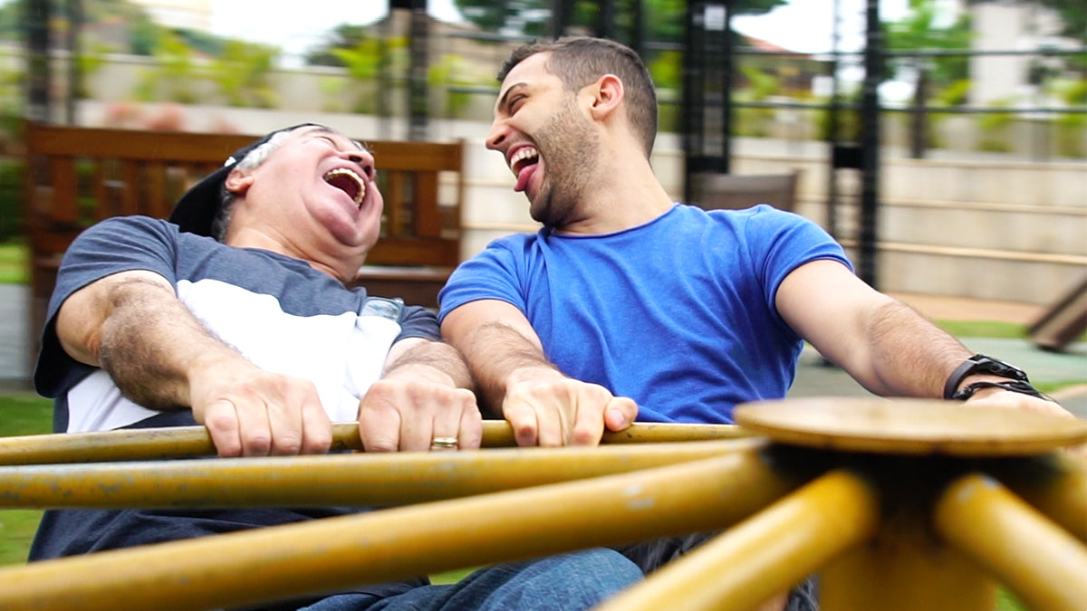 father and son laughing 