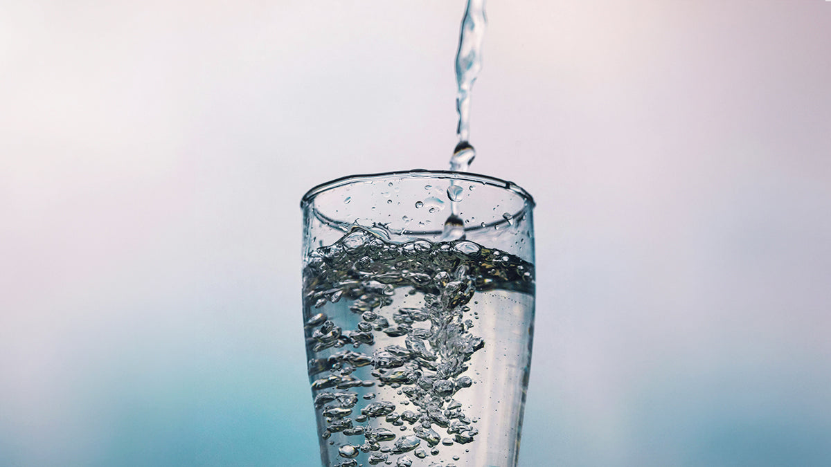 Glass of water being filled up