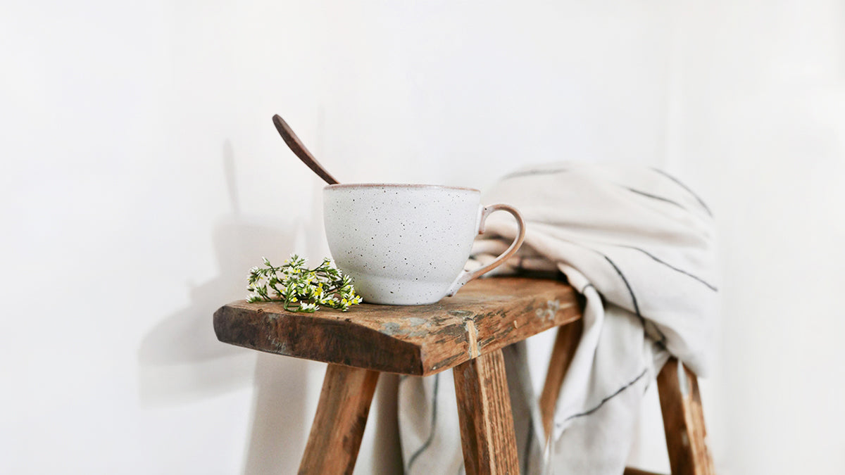 Drinking mug and napkin on a table