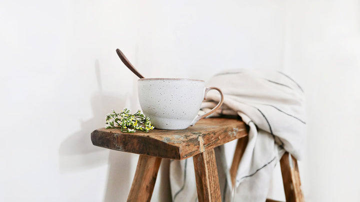 Drinking mug and napkin on a table