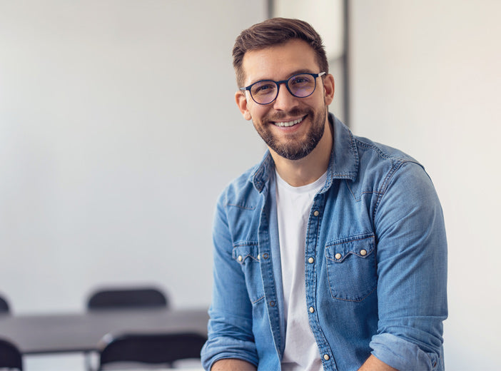 man with glasses smiling