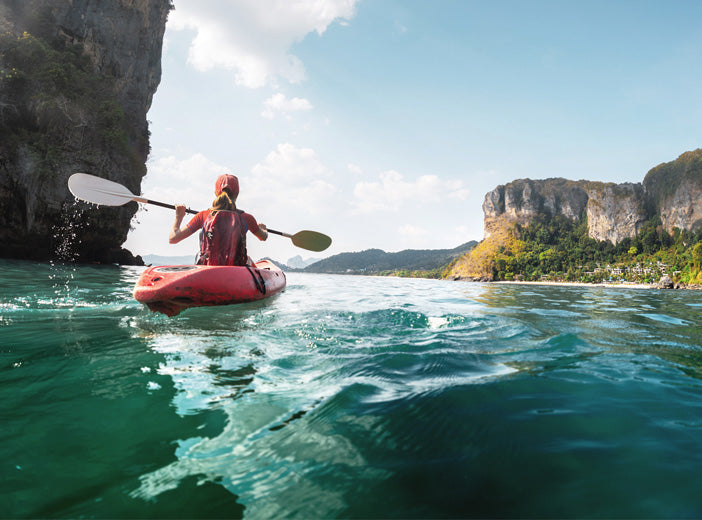 person kayaking in water