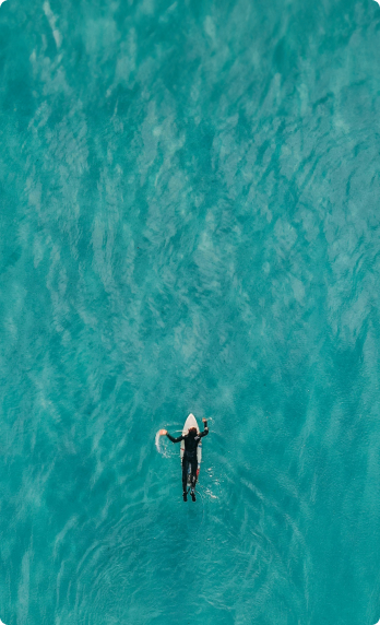 surfer paddling in water